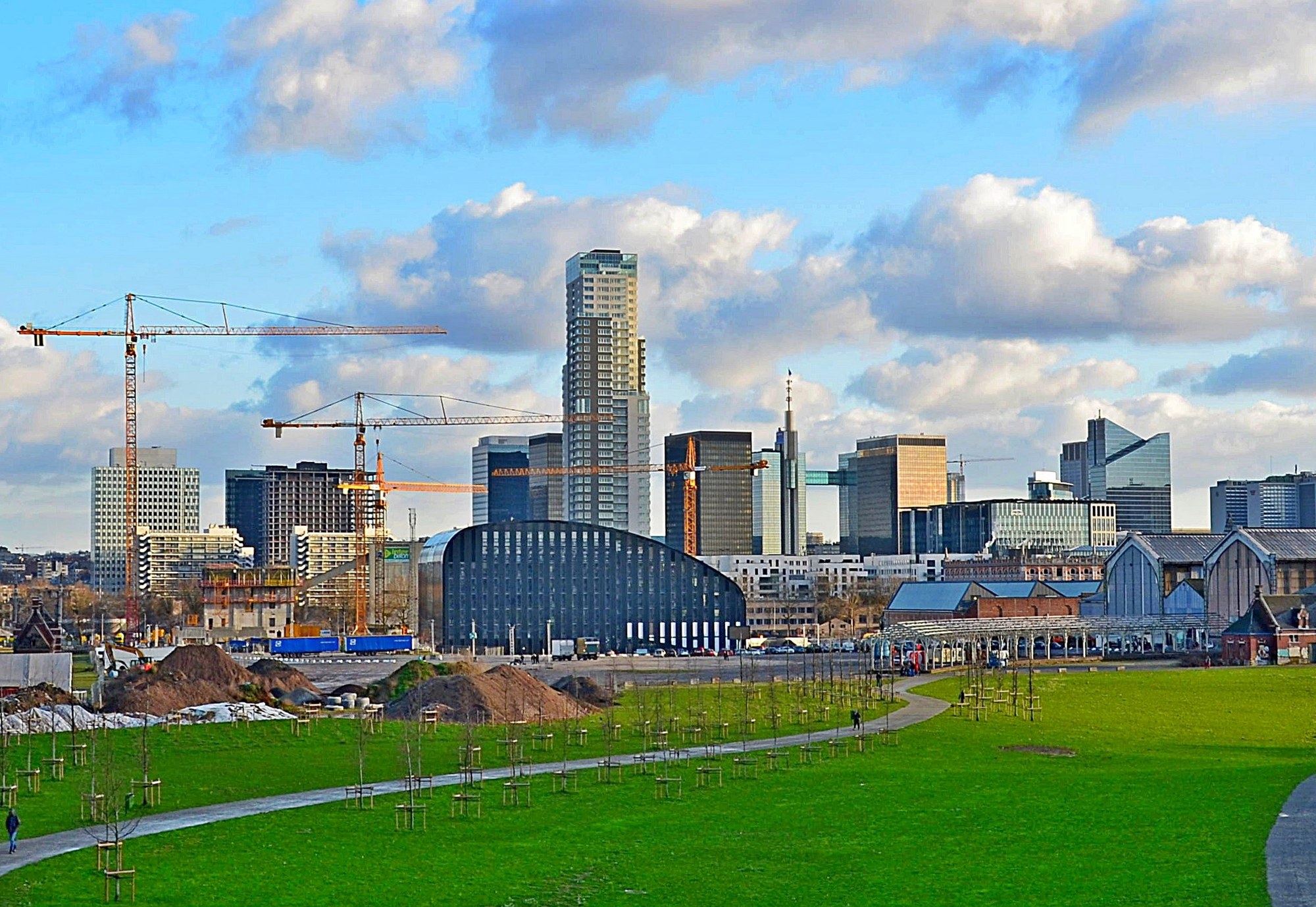 Brussels skyline with construction cranes above the city, illustrating worker accommodation for project teams in Brussels